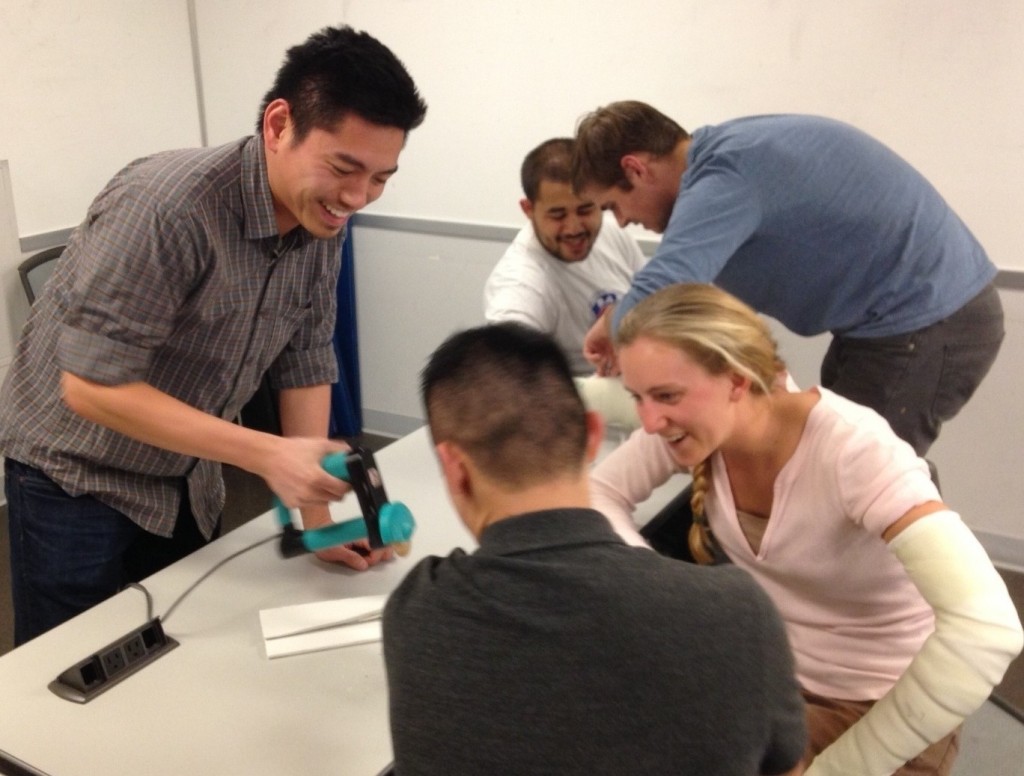 Dr. Shum working with UW medical students